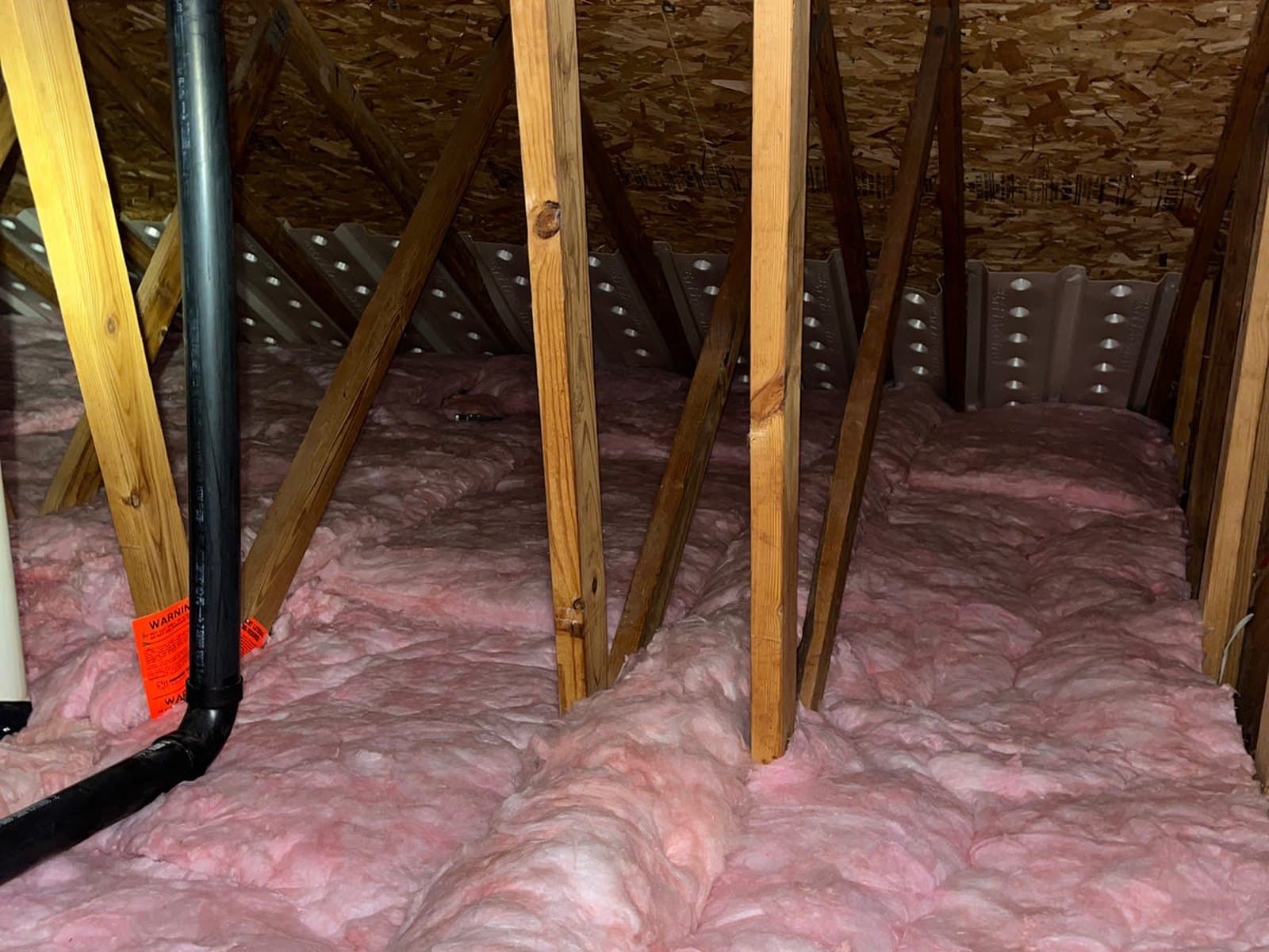 Attic after: clean new batt insulation installed