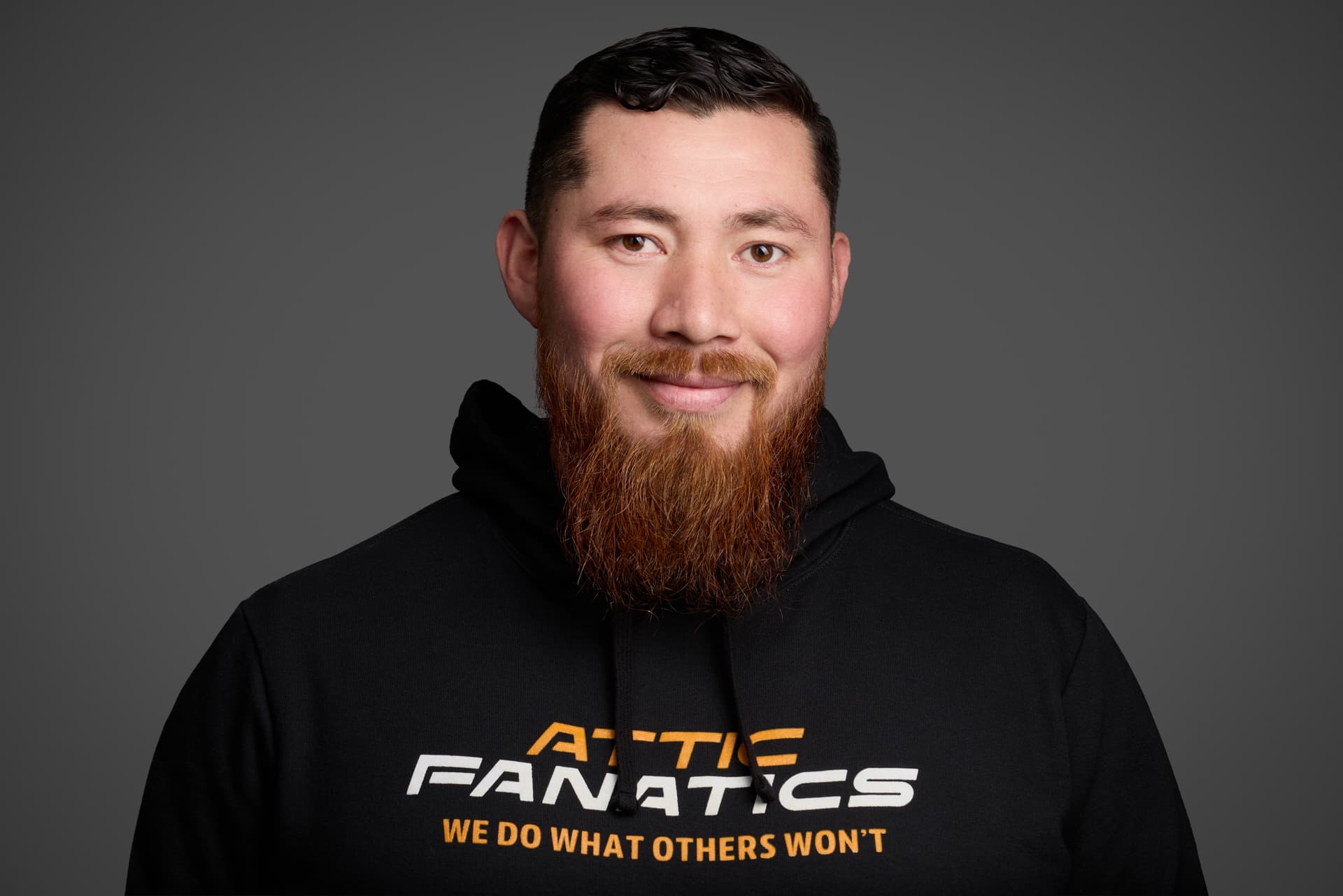 Attic Fanatics team portrait in branded hoodie