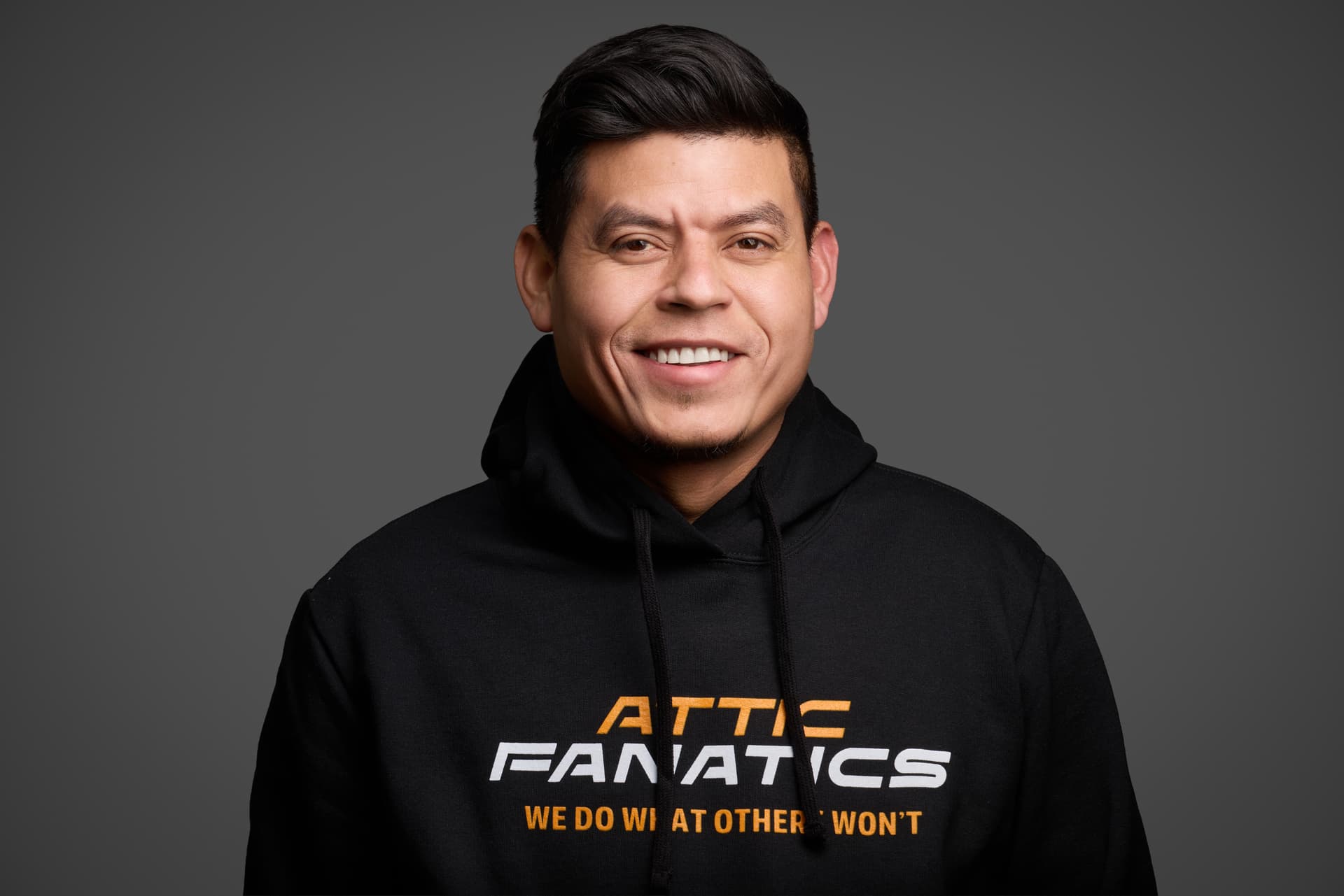 Attic Fanatics team portrait in branded hoodie
