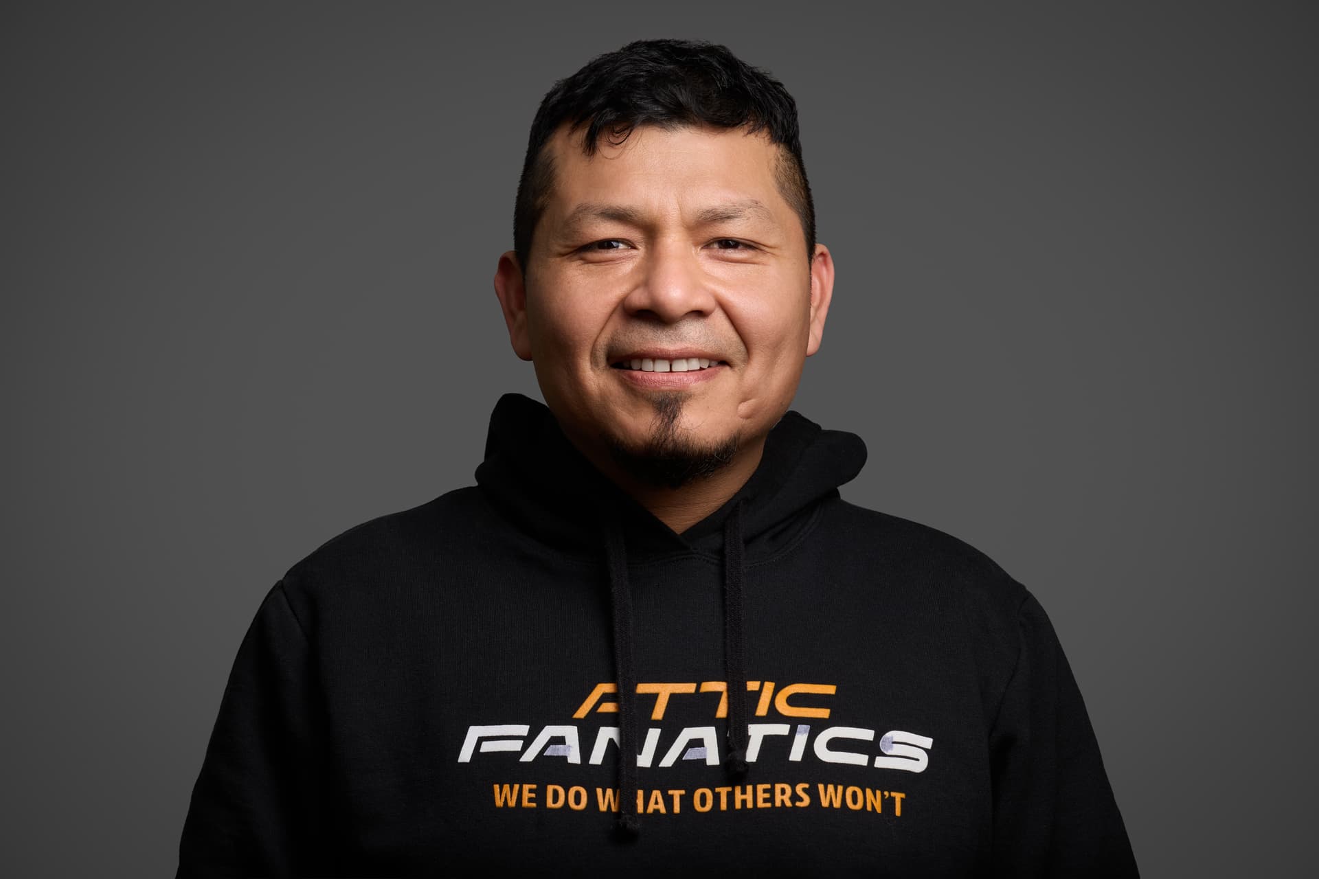 Attic Fanatics team portrait in branded hoodie